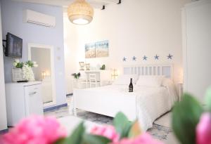Postel nebo postele na pokoji v ubytování BLU MARE suite privata & apartment