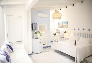 Postel nebo postele na pokoji v ubytování BLU MARE suite privata & apartment