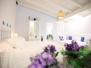Postel nebo postele na pokoji v ubytování BLU MARE suite privata & apartment