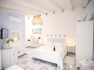 Säng eller sängar i ett rum på BLU MARE suite privata & apartment
