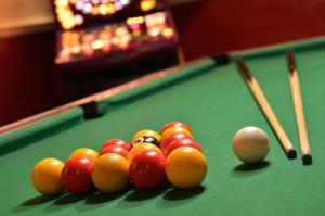 a group of billiard balls on a pool table at Newby Bridge Hotel in Newby Bridge