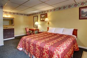 Una cama o camas en una habitación de Star Motel