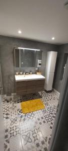a bathroom with a sink and a mirror at Parfum de liberté in Le Bosc