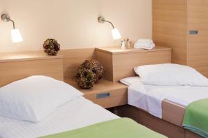Postel nebo postele na pokoji v ubytování Hotel Penzion Kobala