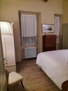 Posteľ alebo postele v izbe v ubytovaní B&B SASSO DI ROCCA