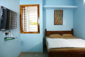 מיטה או מיטות בחדר ב-Bluetique Beach House