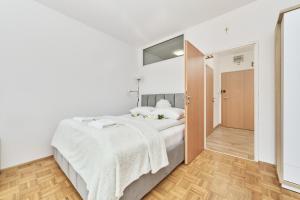Posteľ alebo postele v izbe v ubytovaní Apartments Wrocław Legnicka by Noclegi Renters