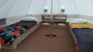 a room with two beds in a tent at Odeceixe Bungalow-Parque de Campismo Sao Miguel in Odeceixe