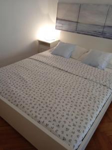 Postel nebo postele na pokoji v ubytování Studio Apartman LENESTA