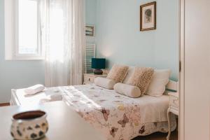 Postel nebo postele na pokoji v ubytování Arya apartment