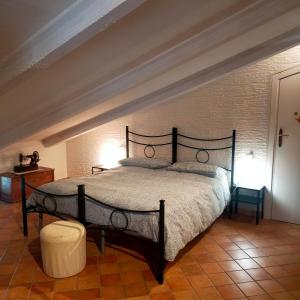 a bedroom with a large bed in a room at MANSARDA VITI - Sguardo su Frontone - in Frontone