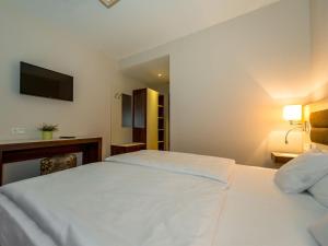Postel nebo postele na pokoji v ubytování Hotel Nordhausen