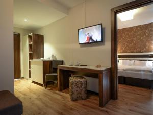 TV a/nebo společenská místnost v ubytování Hotel Nordhausen
