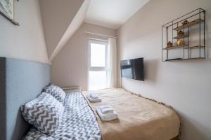 Ένα ή περισσότερα κρεβάτια σε δωμάτιο στο Zoara apartment +22 φωτογραφίες