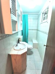 a bathroom with a sink and a toilet at Botanique Guesthouse in Cascais +44 photos