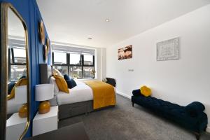 a bedroom with a bed and a mirror at Spacious Designer 2BR Executive Apt, Near Beach & Marina, Central Location in Kent