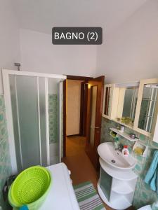 a bathroom with a sink and a toilet and a sink at Piccola Oasi Marittima in Lavagna