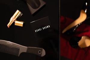 a close up of a razor and a bottle of perfume at The Arran Suite - Your Stylish Scottish Getaway! in Glasgow +17 photos