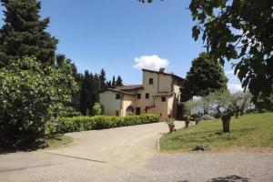 a large house with a driveway in front of it at Villa Selva in Lastra a Signa