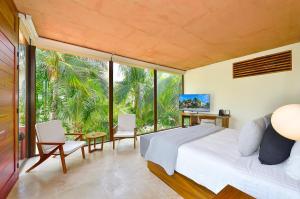 TV a/nebo společenská místnost v ubytování Tago Tulum by G Hotels