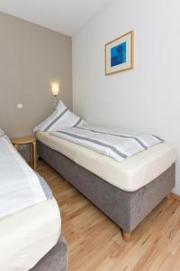 Un pat sau paturi într-o cameră la Klippersteven