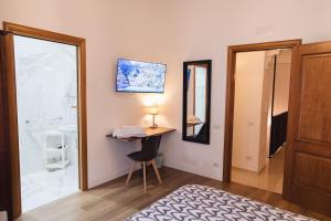 A bed or beds in a room at Relais CuoreNapoletano
