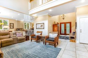 a living room with a couch and a table at Bufflehead 3 in Kiawah Island