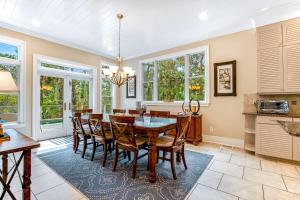 a kitchen and dining room with a table and chairs at Bufflehead 3 in Kiawah Island