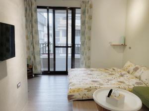 Voodi või voodid majutusasutuse LeeHo B&B 李何寓所 toas