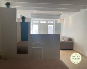 a living room with a couch and a table at Dimora Pugliese in Palo del Colle +6 photos