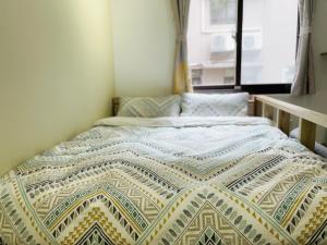 Voodi või voodid majutusasutuse LeeHo B&B 李何寓所 toas