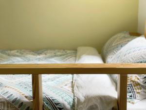 Voodi või voodid majutusasutuse LeeHo B&B 李何寓所 toas
