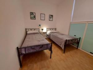 Posteľ alebo postele v izbe v ubytovaní Esperia 23