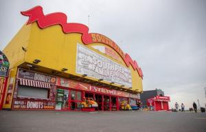 a fast food restaurant with a large yellow and red building at Withnell Stays - Apartment Three in Blackpool