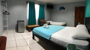 Postel nebo postele na pokoji v ubytování Hospedaje Colibri