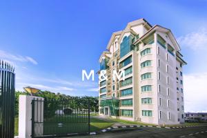 a white building with the mtn sign on it at AA Residen Luxury Condo HOMESTAY 18mins walk Tanjung Aru Beach & GOLF Course, not Beach Side Resort in Kota Kinabalu