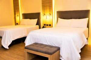Postel nebo postele na pokoji v ubytování Hotel Plaza by Kavia