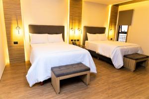 Postel nebo postele na pokoji v ubytování Hotel Plaza by Kavia