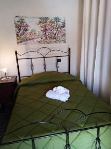 Ένα ή περισσότερα κρεβάτια σε δωμάτιο στο La Giara B&B