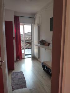 a room with a hallway with a door to a balcony at Ristorante le bucce di Gandria in Gandria