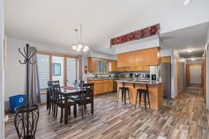 a kitchen and dining room with a table and chairs at Coeur d'Alene Cozy in Coeur d'Alene