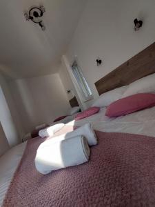 Postel nebo postele na pokoji v ubytování Apartmani NIKA