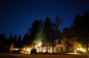 a house at night with cars parked in front of it at Thomsonite Inn on Lake Superior in Grand Marais