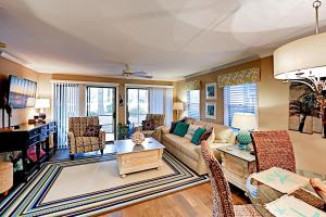 a living room with a couch and chairs at Pawleys Island in Pawleys Island