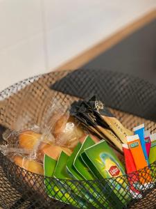 a basket filled with fruits and vegetables on a table at Tous'o'Zoo, au cœur du centre-ville in Saint-Aignan