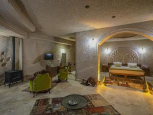 TV a/nebo společenská místnost v ubytování Kalsedon Cave Suites