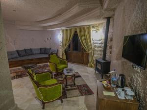 TV a/nebo společenská místnost v ubytování Kalsedon Cave Suites