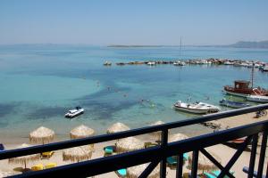 a view of a harbor with boats in the water at Hotel Alexandra in Skala