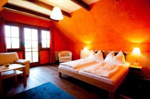 Postel nebo postele na pokoji v ubytování Hotel Garni Winzerhof Hödl