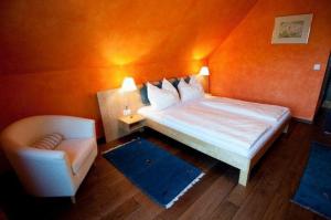 Postel nebo postele na pokoji v ubytování Hotel Garni Winzerhof Hödl